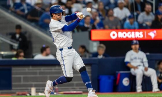 Photo of Ernie Clement somehow hitting an incredibly high pitch for a home run