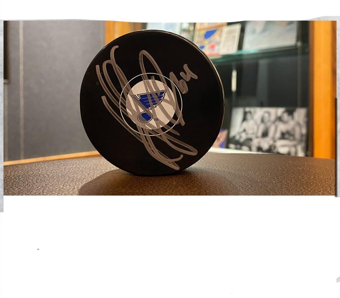 Anyone know who signed this mystery puck?