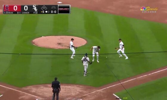 Four White Sox watch a routine pop fly drop at their feet.