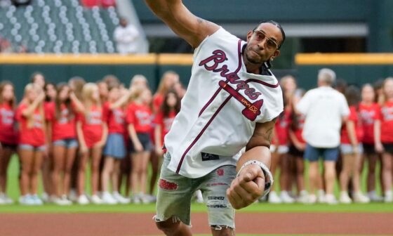 Ludacris with the unique outfit for his first pitch at Braves game