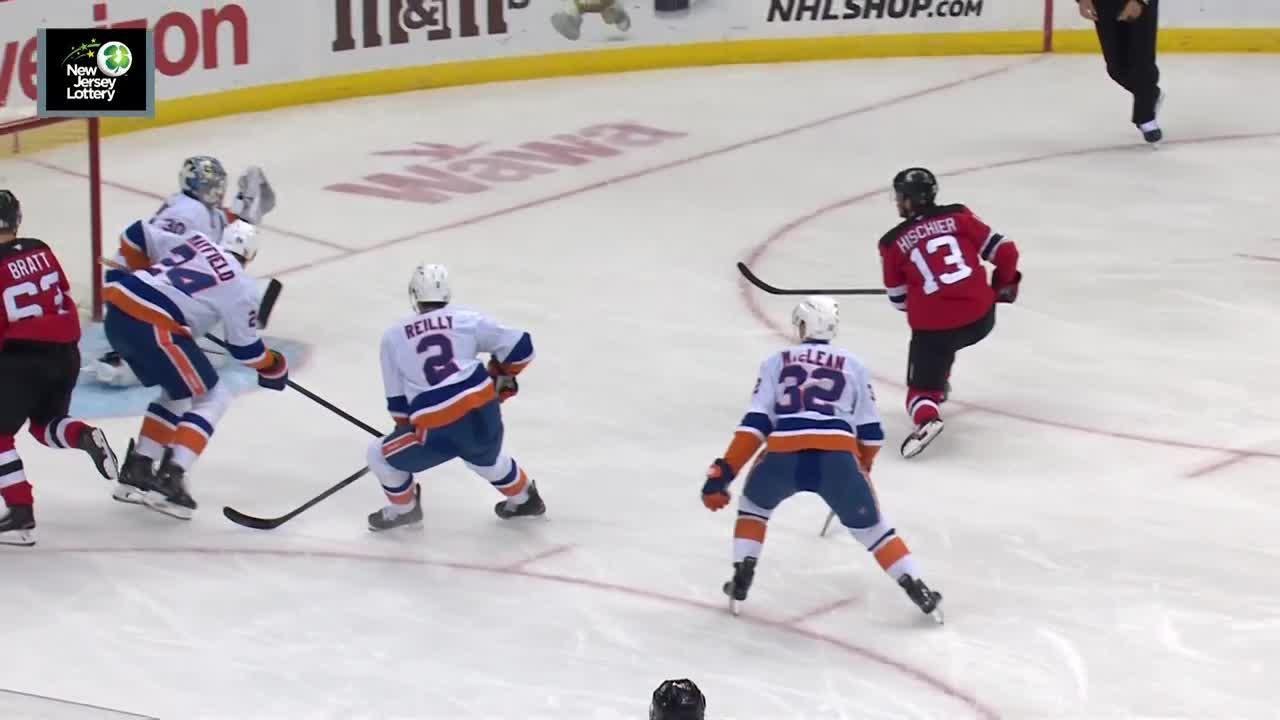 Nico Hischier scores a goal against the New York Islanders