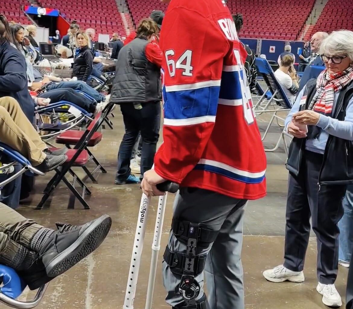 David Reinbacher on crutches talking to fans at the Habs blood drive today