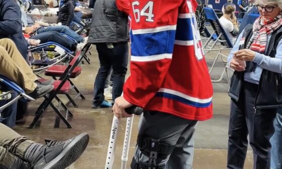 David Reinbacher on crutches talking to fans at the Habs blood drive today