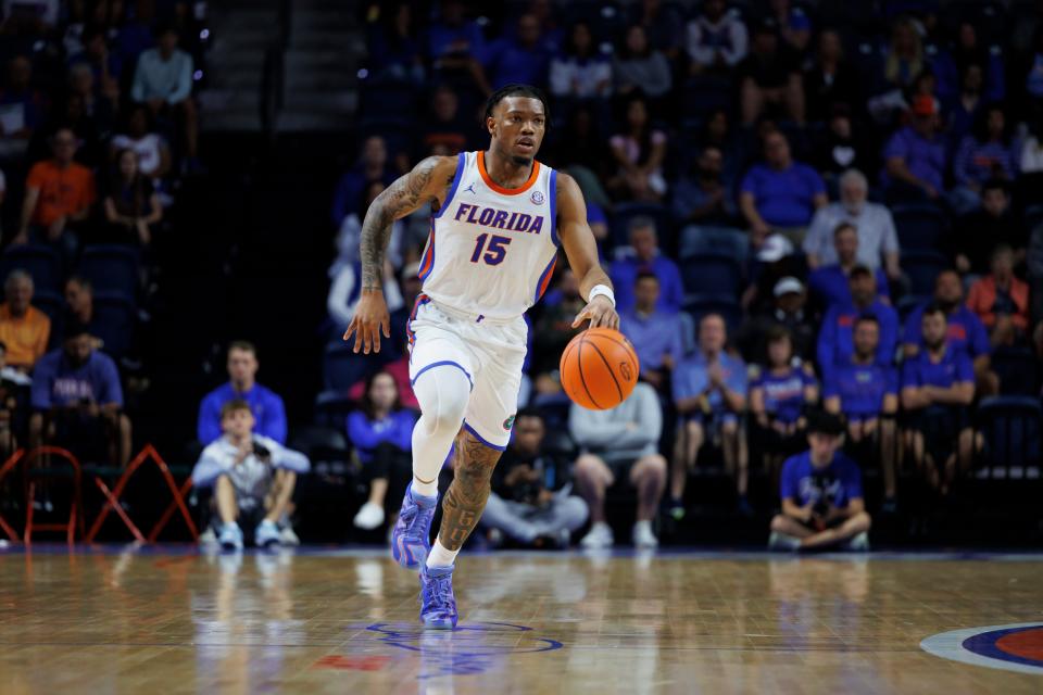 Nov 19, 2024; Gainesville, Florida, USA; Florida Gators guard Alijah Martin (15) dribbles the ball up the court against the Florida A&M Rattlers at Exactech Arena at the Stephen C. O'Connell Center. Mandatory Credit: Morgan Tencza-Imagn Images