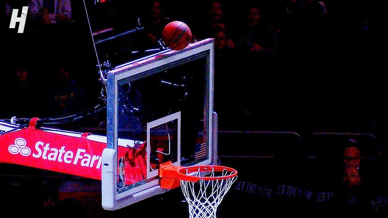 Bucks Fan NAILS INSANE HALF-COURT SHOT off the Top of the Backboard for $10,000 🤑