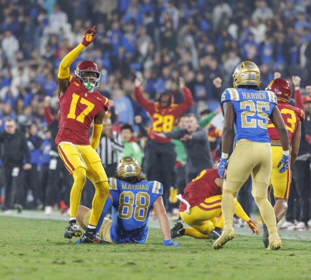 USC cornerback DeCarlos Nicholson celebrates after breaking up a pass intended for UCLA tight end Moliki Matavao