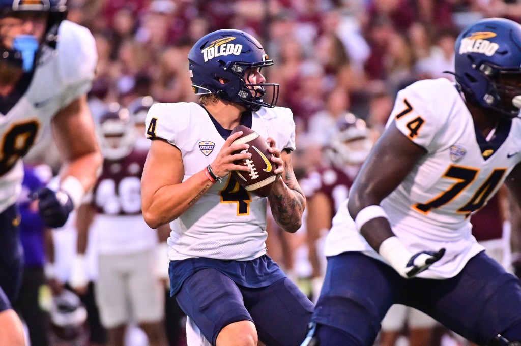 Toledo Rockets quarterback Tucker Gleason (4) looks to pass against the Mississippi State Bulldogs during the first quarter at Davis Wade Stadium at Scott Field. 