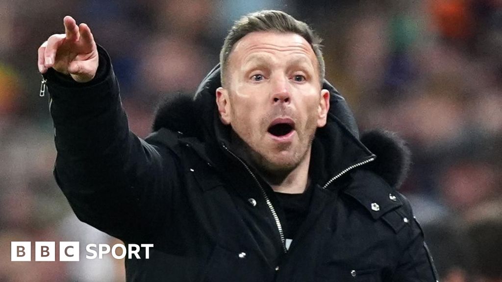 Wales manager Craig Bellamy celebrates with Harry Wilson and Ben Davies