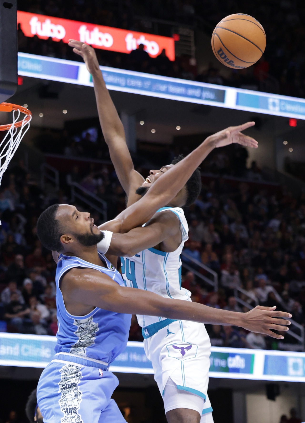 Cavaliers forward Evan Mobley (4) blocks a shot