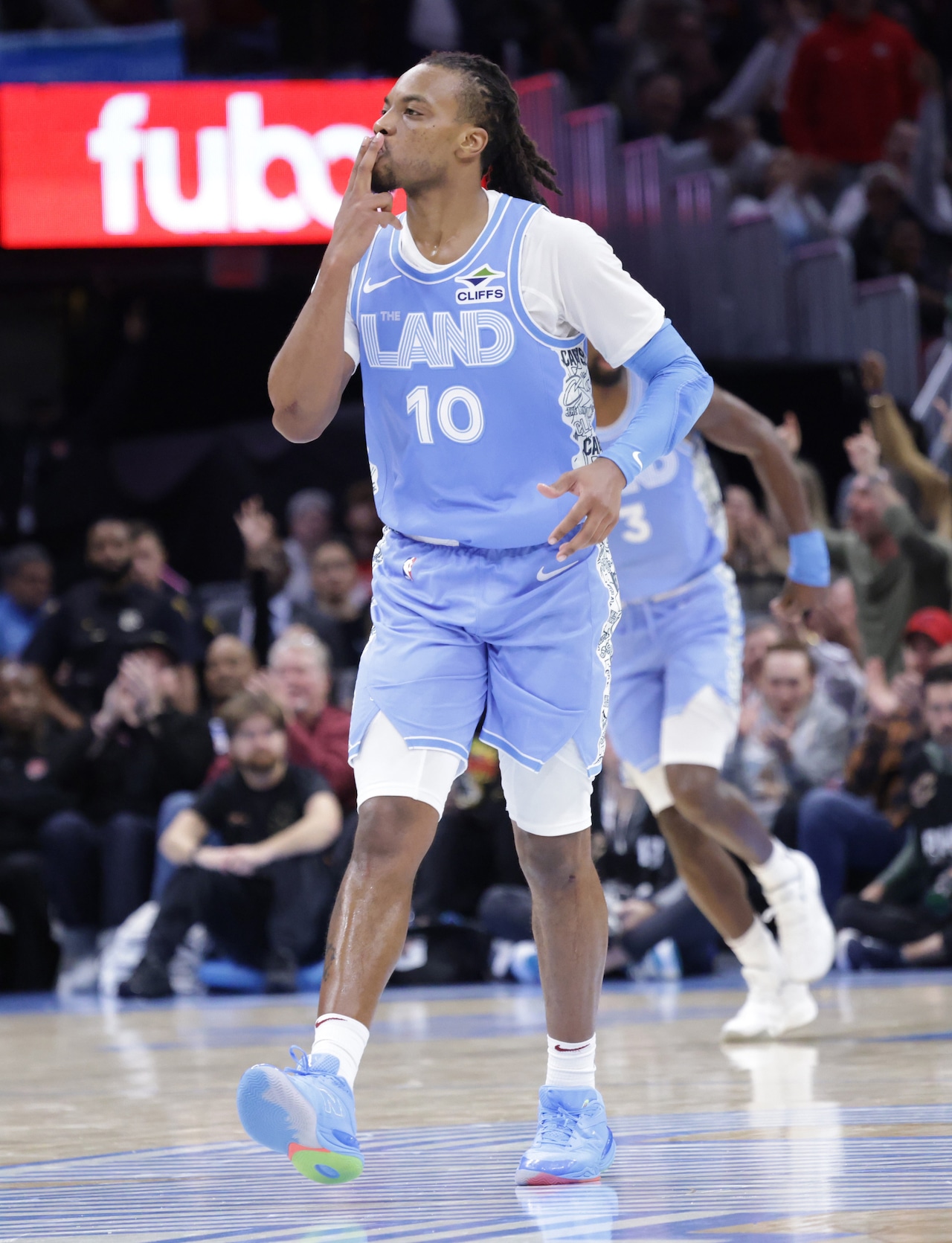 Cavaliers guard Darius Garland (10) celebrates his three-pointer