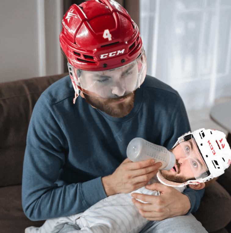 IT'S GAME- Oh sorry Raz, I'll be quiet.  It's gameday!  This is Michael, rasmus's son.  He's feeding him milk just like he's going to feed the red wings 7 goals tonight.  Go flames!