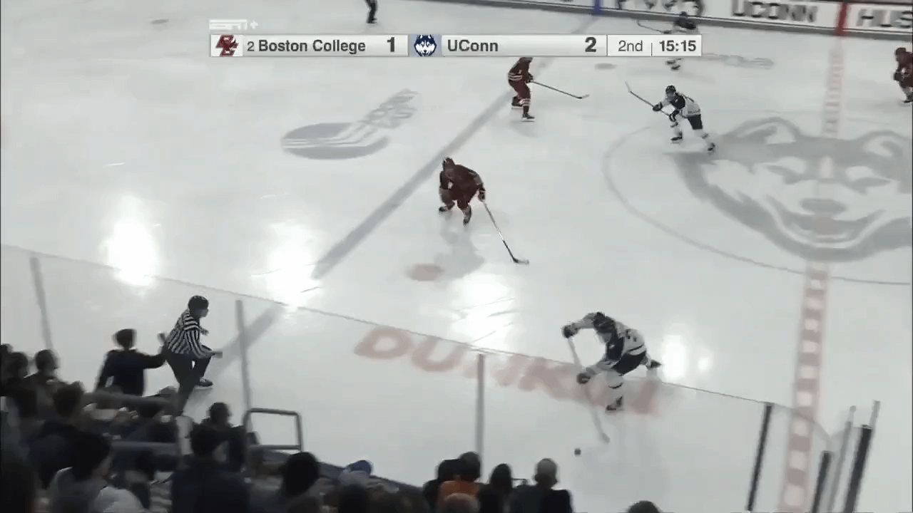 Boston College’s goalie throws a blocker punch after a UConn forward collides with him after scoring