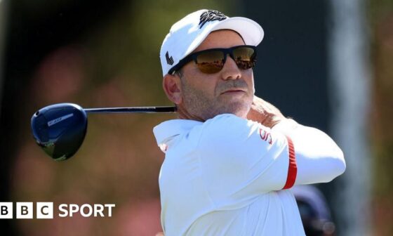 Sergio Garcia in sunglasses with a golf club after taking a shot