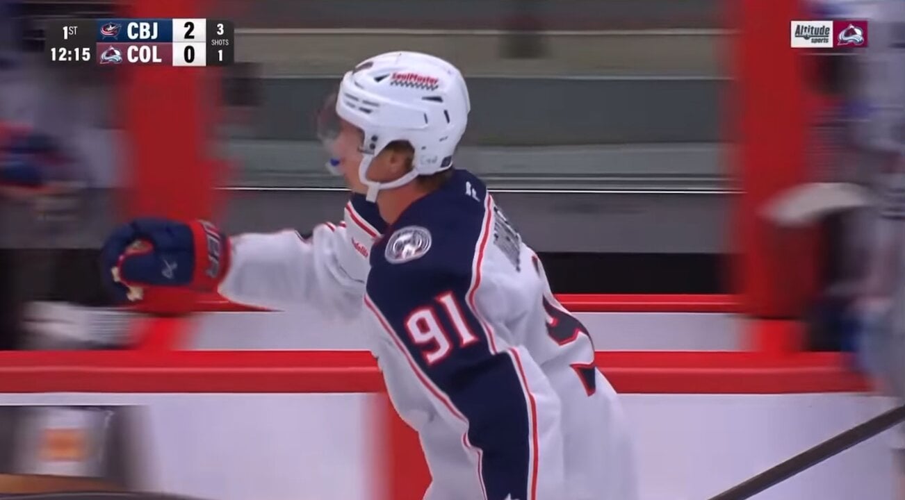 KJ high fiving the bench - and Johnny