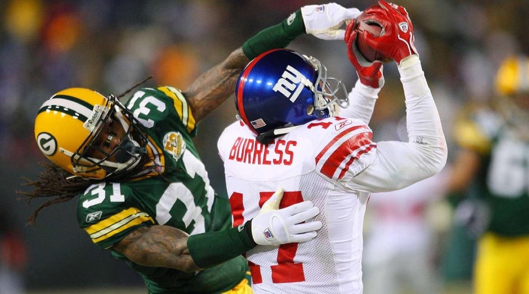 Who had the more dominant NFCCG performance: Plaxico Burress against Al Harris or Victor Cruz against Carlos Rogers?