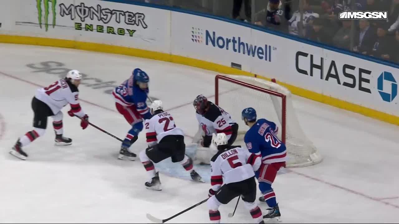 Chris Kreider scores a goal against the New Jersey Devils