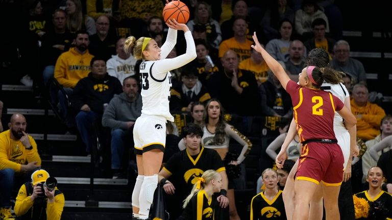 Iowa guard Lucy Olsen (33) shoots over Iowa State guard...