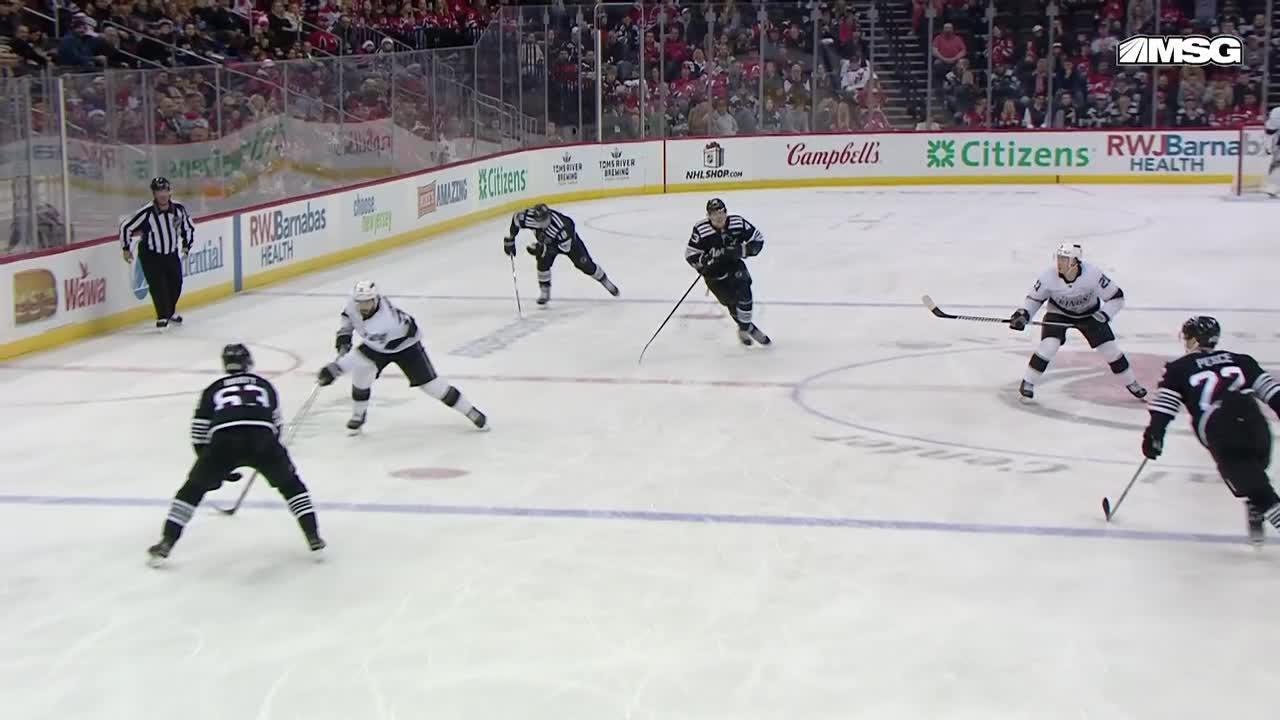 Jordan Spence scores a goal against the New Jersey Devils