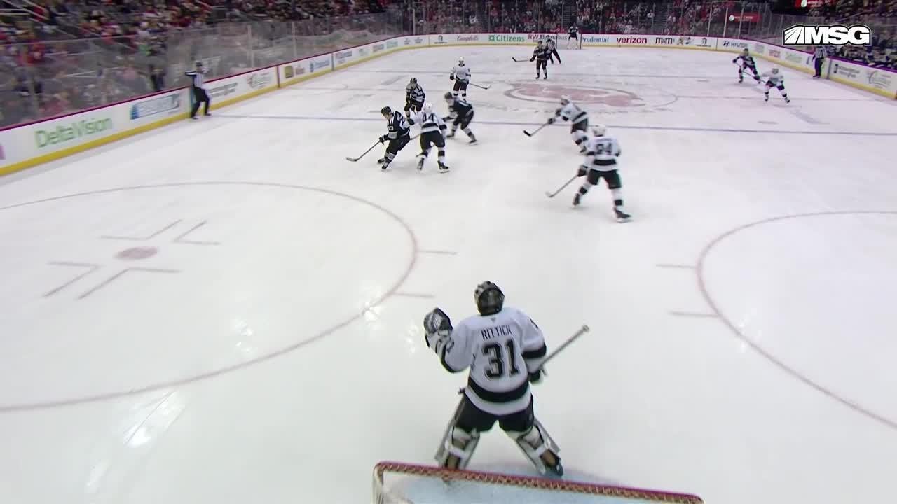 Jack Hughes scores a goal against the Los Angeles Kings