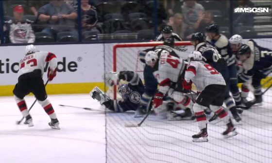 Luke Hughes scores a goal against the New Jersey Devils