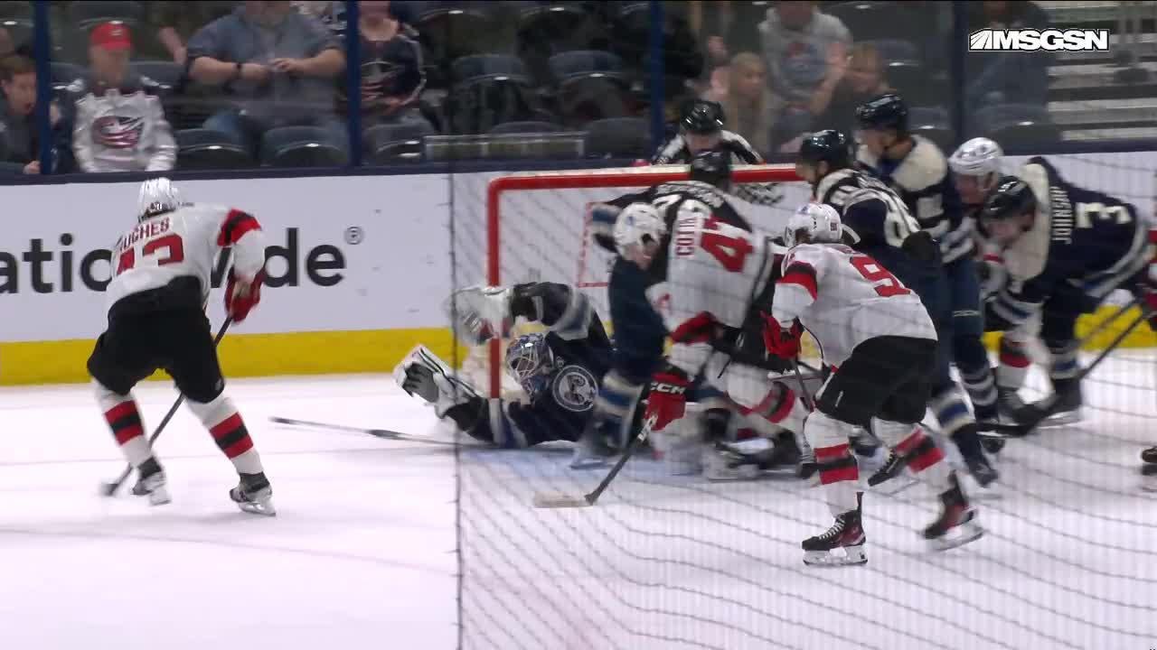 Luke Hughes scores a goal against the New Jersey Devils