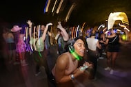 Guests participate in a Silent Disco event at Klyde Warren Park in Dallas on Sept. 6, 2024.