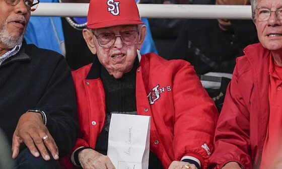 Lou Carnesecca sits in the arena named after him to watch a game back in October last year