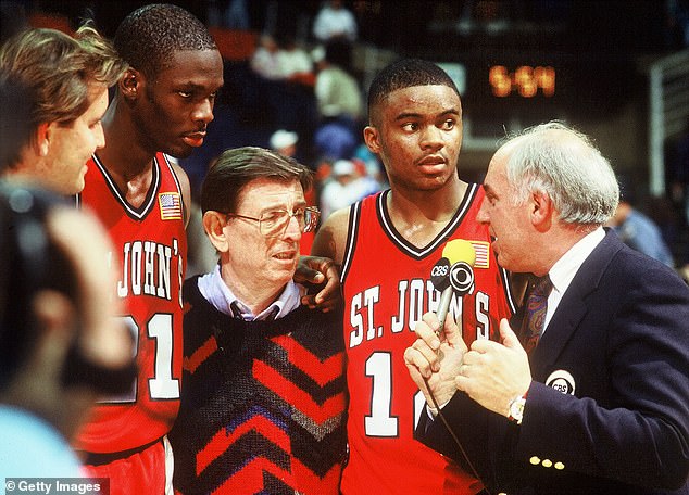 The iconic coach is interviewed by Billy Packer (1940-2023) after a game against UConn in 1990