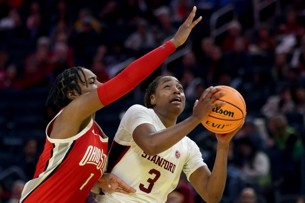 Stanford's Nunu Agara #3 drives on Ohio State's Ajae Petty #1 in the fourth quarter at Chase Center in San Francisco, Calif., Friday, Dec. 20, 2024. (Karl Mondon/Bay Area News Group)