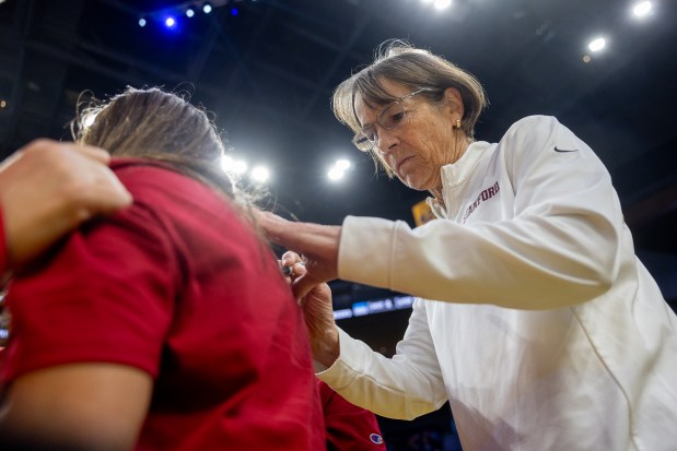 Former Stanford women's basketball coach Tara VanDereer signs an autograph during a break in the game versus Ohio State at the Chase Center in San Francisco, Calif., Friday, Dec. 20, 2024. (Karl Mondon/Bay Area News Group)