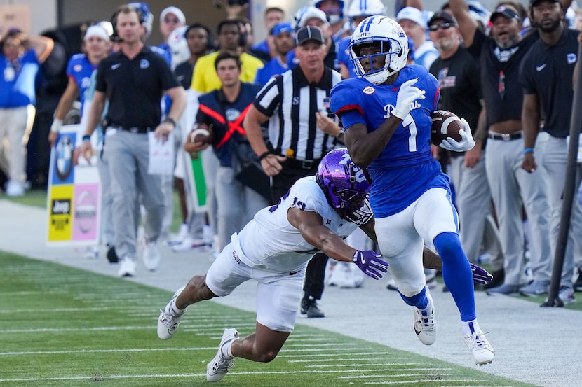 SMU running back Brashard Smith (1) races down the sidelines past TCU cornerback JaTravis...