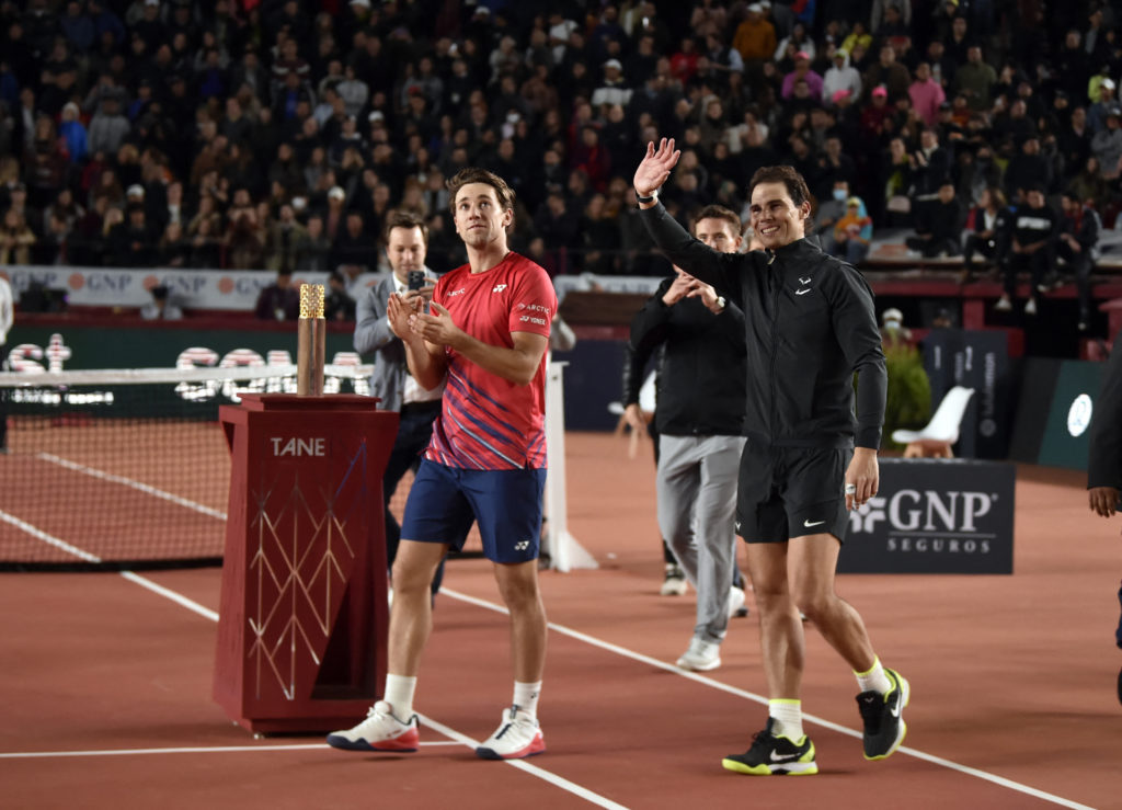 Spanish player Rafael Nadal (R) and Norwegian player Casper Ruud wave goodbye after an exhibition match at the Plaza de Toros in Mexico City on Dec...