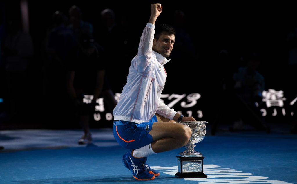 Novak Djokovic of Serbia poses with the Norman Brookes Challenge Cup after winning the Men's Singles Final match against Stefanos Tsitsipas of Gree...