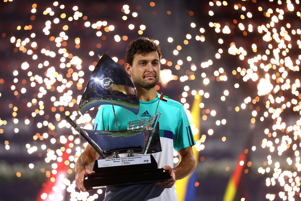 Aslan Karatsev of Russia poses with the trophy after beating Lloyd Harris of South Africa to win the men's singles Final match during day fourteen ...