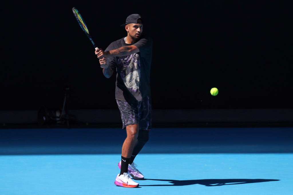 Nick Kyrgios of Australia plays a backhand during a practice session ahead of the 2023 Australian Open at Melbourne Park on January 14, 2023 in Mel...