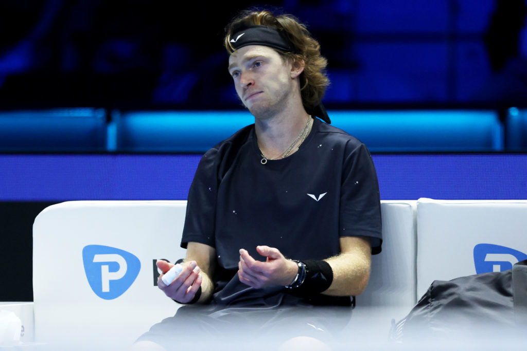 Andrey Rublev looks dejected after defeat to Carlos Alcaraz of Spain in the Men's Singles Round Robin match on day four of the Nitto ATP Finals at ...