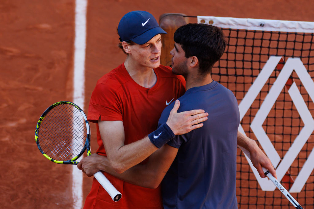 Carlos Alcaraz of Spain shakes hands with Jannik Sinner of Italy after beating him in the semi-final of the men's singles at Roland Garros on June ...