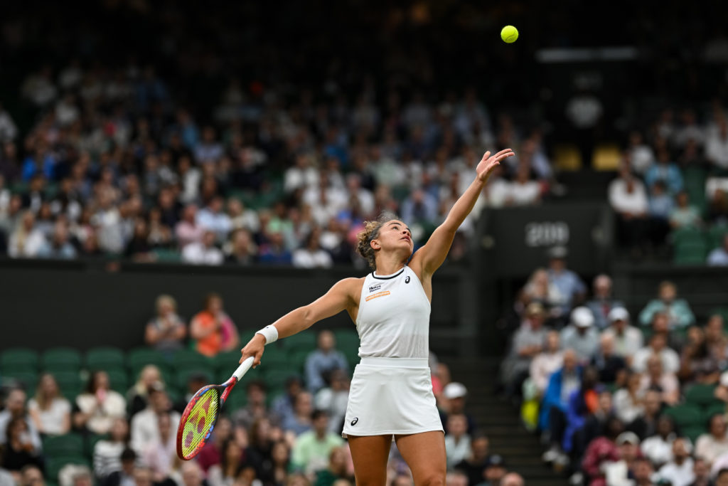 Jasmine Paolini of Italy serves against Emma Navarro of the United States in the Ladies' Singles Quarter Final match during day nine of The Champio...