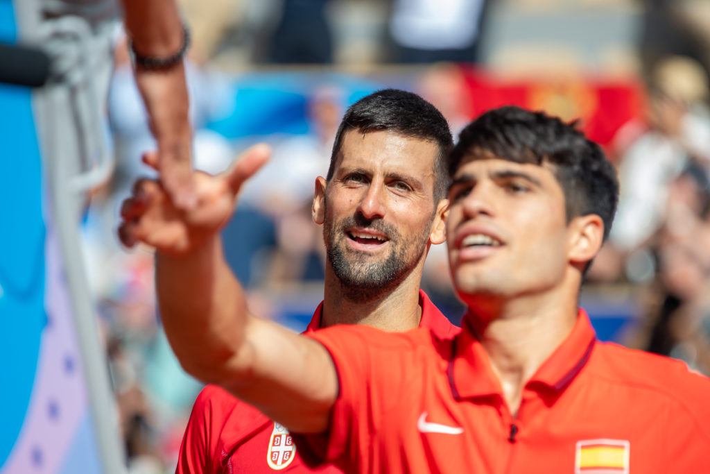 Novak Djokovic of Serbia looks on in match against Carlos Alcaraz of Spain during the Men's Singles Gold Medal Match on day nine of the Olympic Gam...