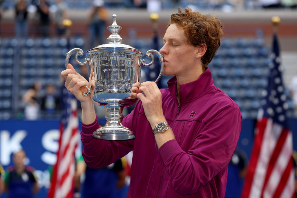 Jannik Sinner of Italy celebrates with the winners trophy after defeating Taylor Fritz of the United States to win the Men's Singles Final on Day F...