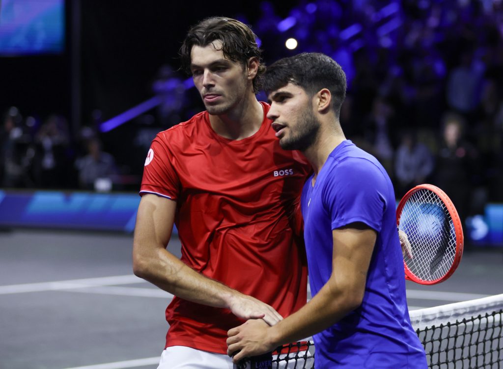 Taylor Fritz of Team World and Carlos Alcaraz of Team Europe shake hands after their Men's Singles match on day three of the Laver Cup at Uber Aren...