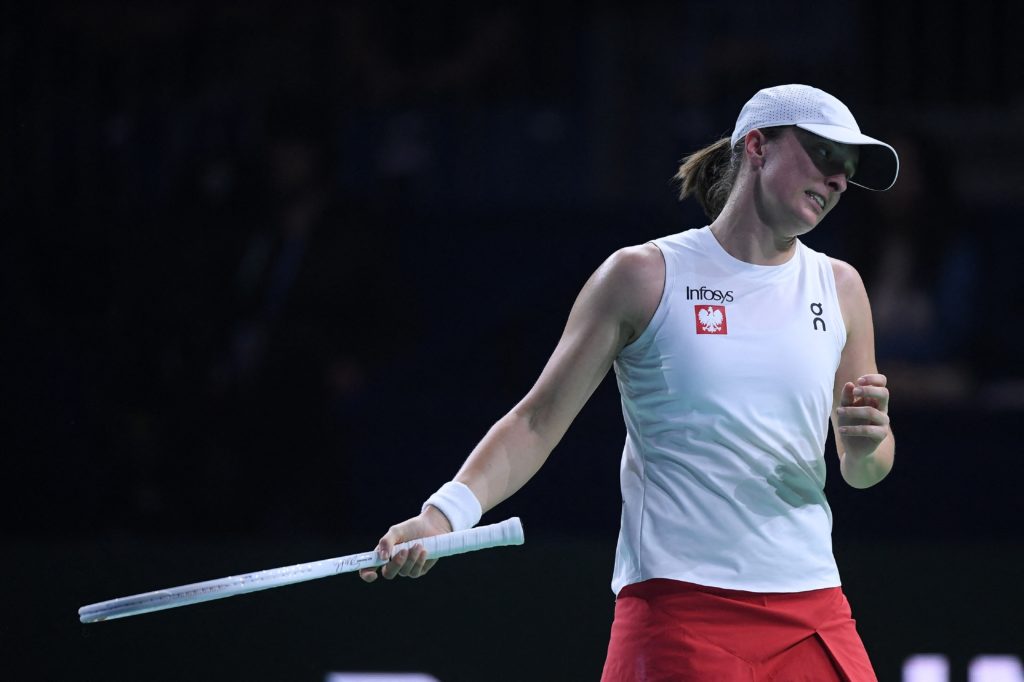 Poland's Iga Swiatek reacts during the semi-finals singles tennis match between Poland and Italy at the Billie Jean King Cup Finals at the Palacio ...