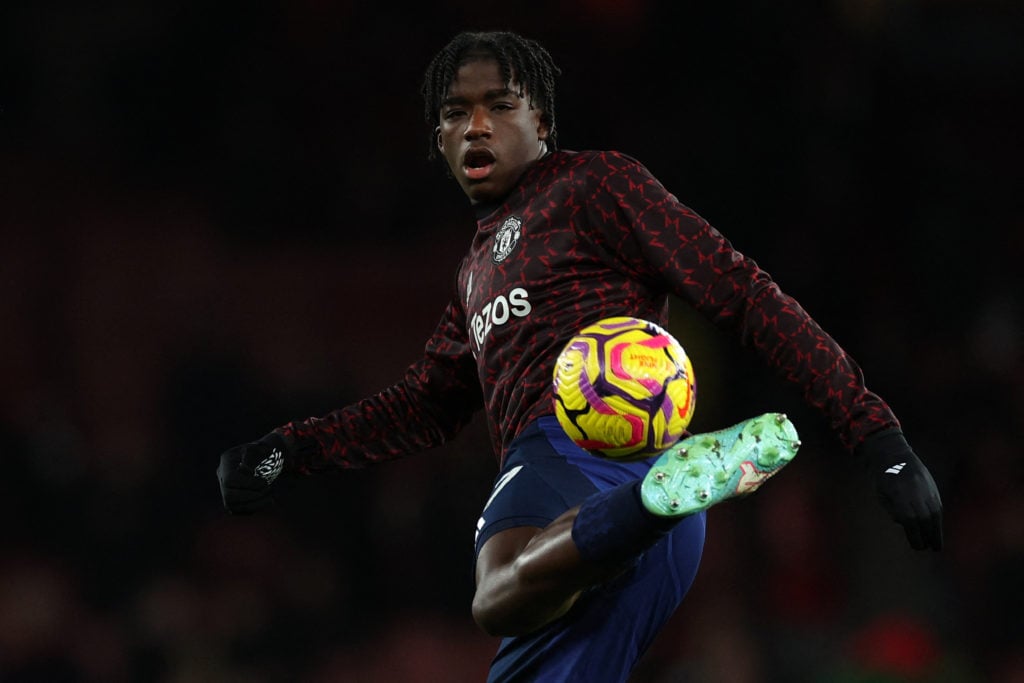 Manchester United's English defender #87 Godwill Kukonki warms up ahead of during the English Premier League football match between Arsenal and Man...