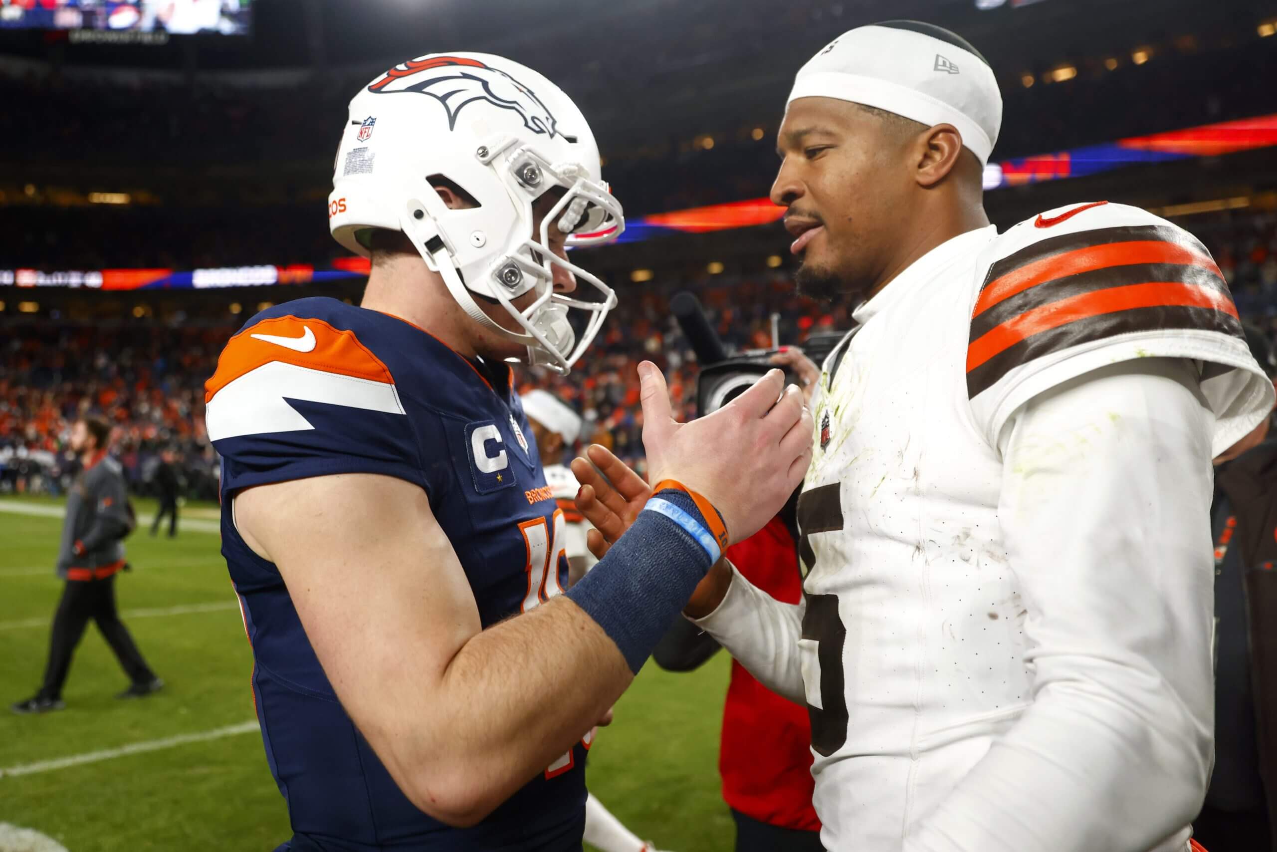 Bo Nix of the Denver Broncos shakes hands with Jameis Winston of the Cleveland Browns after the game at Empower Field At Mile High on December 02, 2024 in Denver, Colorado.