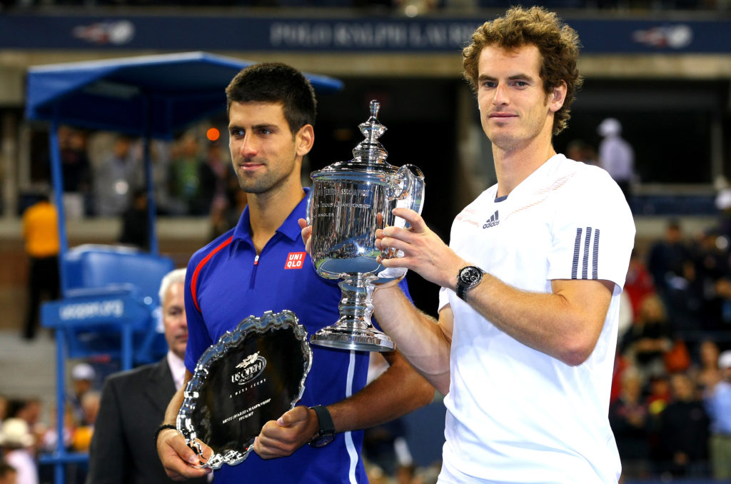 Andy Murray of Great Britain smiles as he holds aloft the trophy following his win over Novak Djokovic of Serbia in the Final of the US Open, 2012