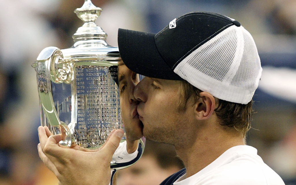 Andy Roddick (USA) kisses the US Open championship trophy during the awards ceremony for the men's finals. Roddick defeated Juan Carlos Ferrero (ES...