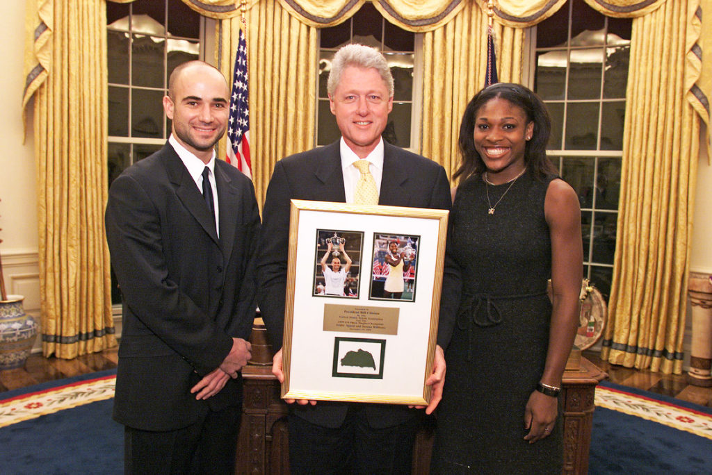 American politician US President Bill Clinton (center) poses with US Open Tennis Champions Andre Agassi (left) and Serena Williams in the White Hou...