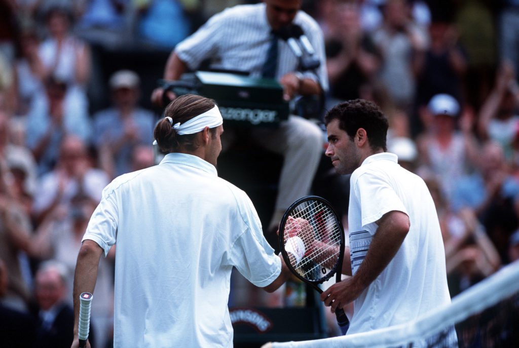 Pete Sampras of the USA congratulates Roger Federer of Switzerland following his victory during the men's fourth round of The All England Lawn Tenn...