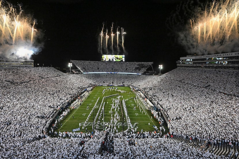 Penn State takes the field for an NCAA college football game against Washington amidst a...