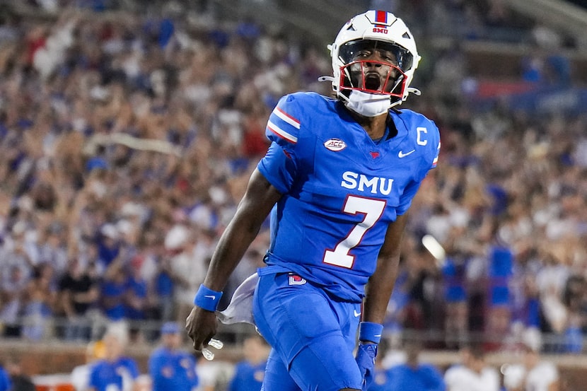 SMU quarterback Kevin Jennings (7) celebrates after throwing a touchdown pass to running...